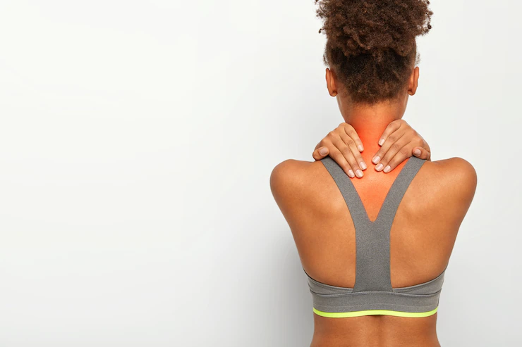 cropped-image-faceless-african-american-woman-touches-neck-with-both-hands-shows-problematic-zone-being-injured-dressed-active-wear-poses-white-studio-wall-blank-space-text_273609-32107