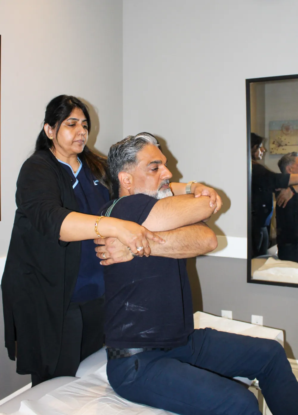 Physiotherapist treating patient